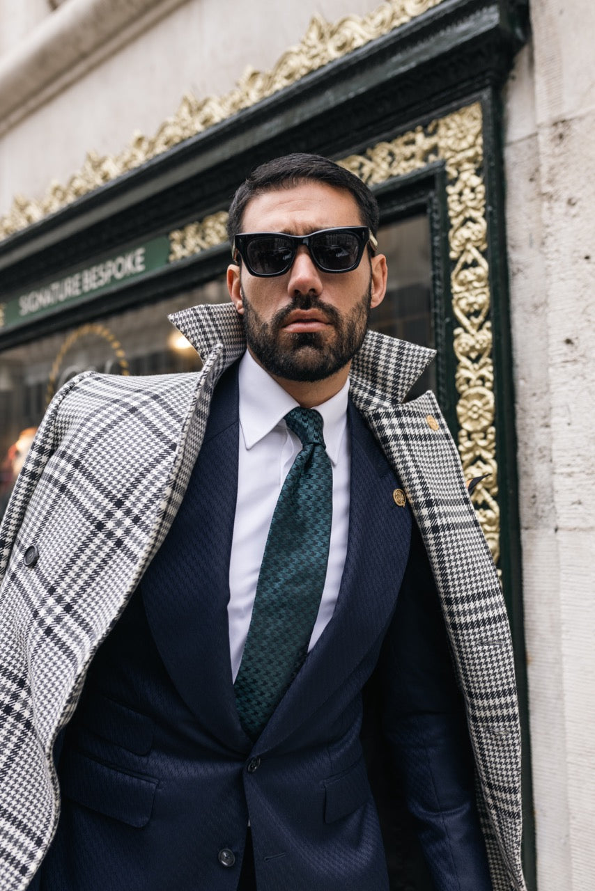 Model wearing a bespoke suit and overcoat for autumn tailoring