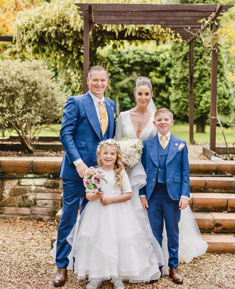 A groom and his family wearing coordinated wedding tailoring