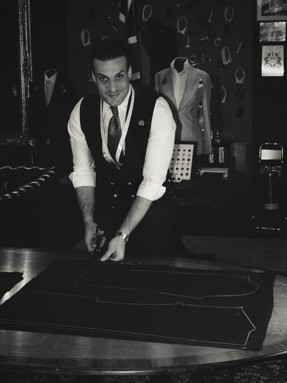 Mo Adass Signature Bespoke founder cutting fabric